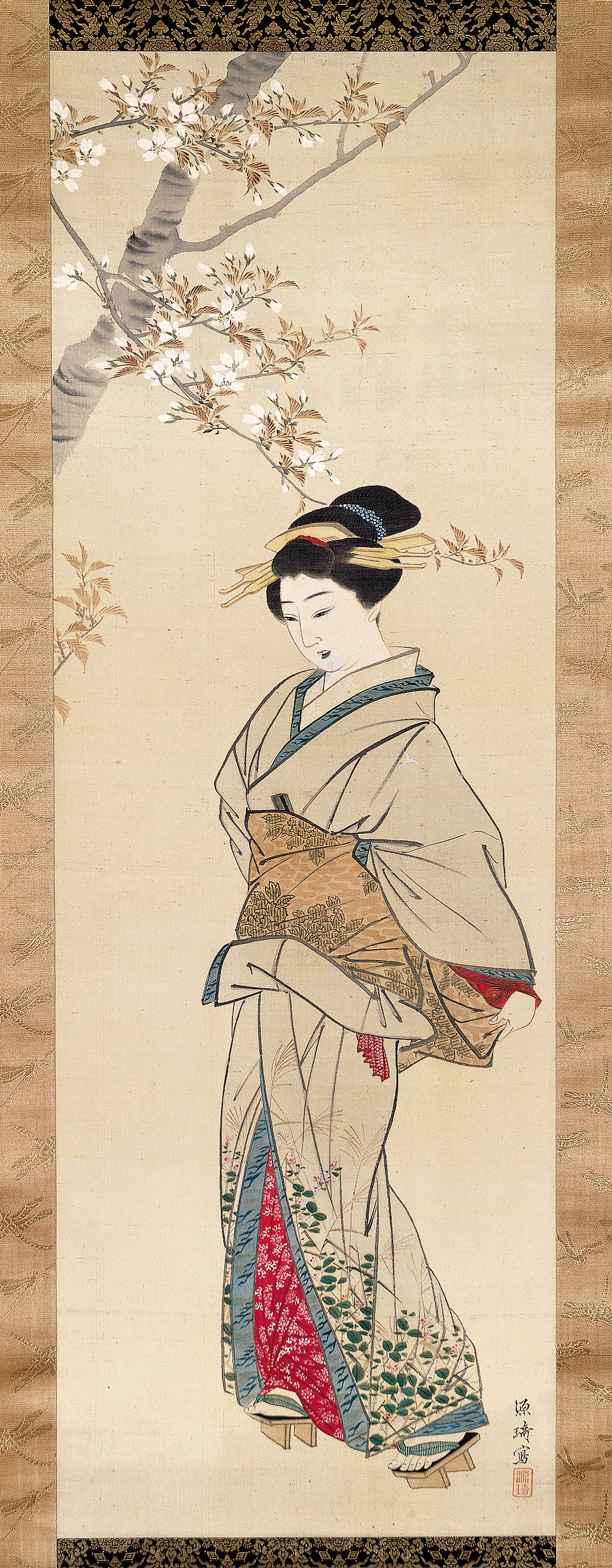 桜の下を歩く女