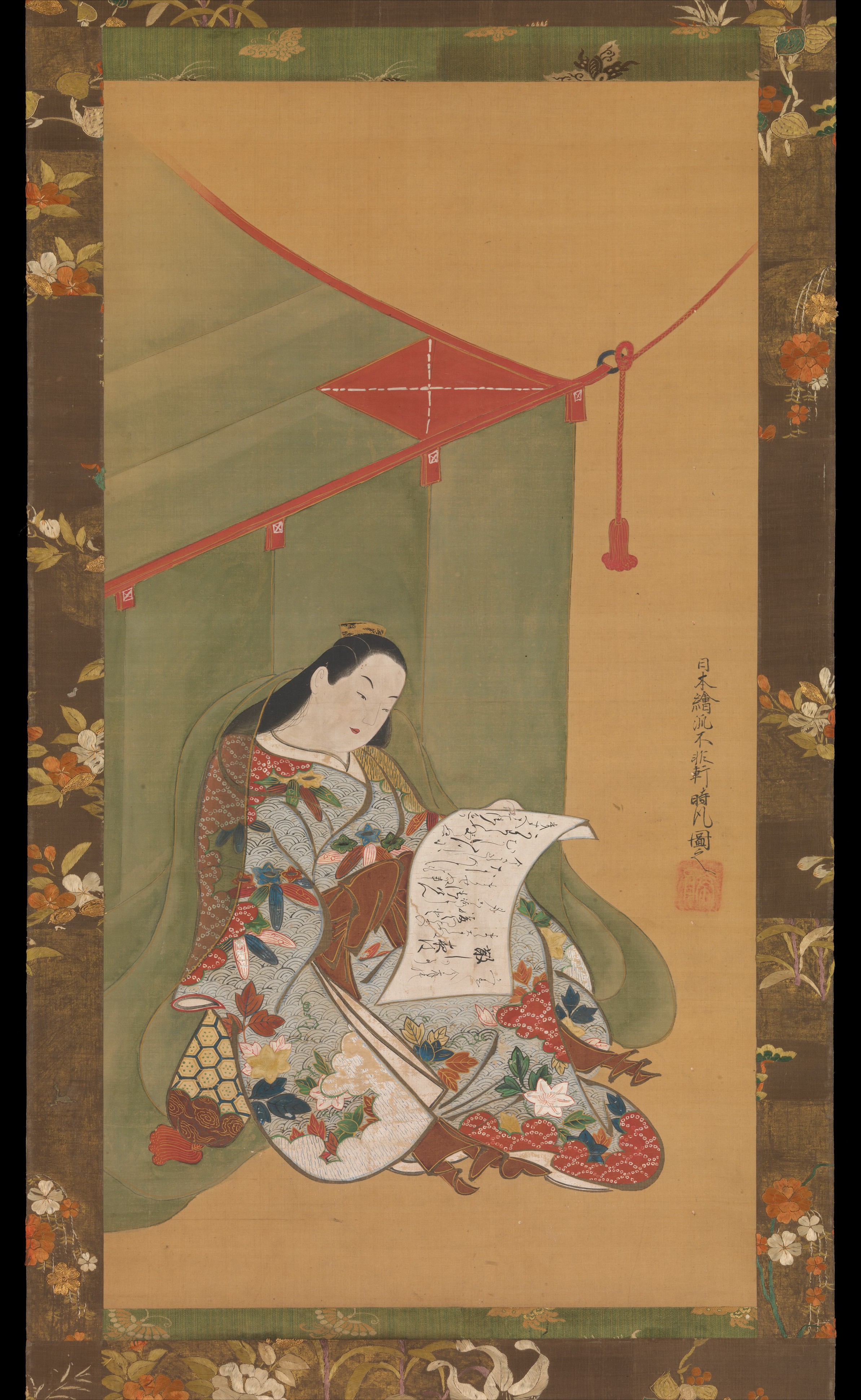 蚊帳の下で読書をする女性