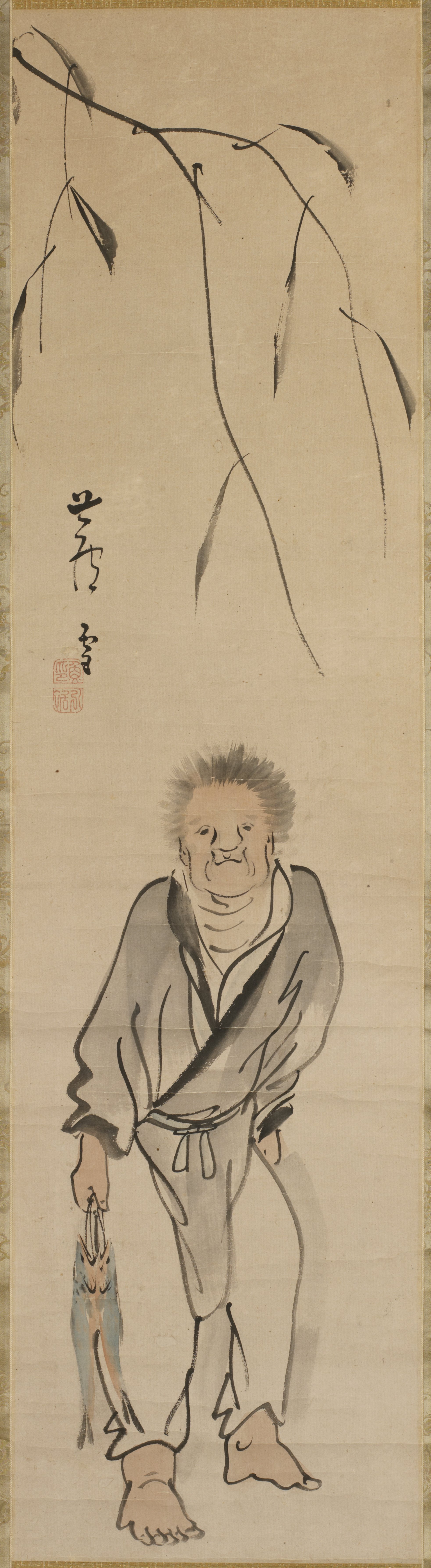 魚を持つ男