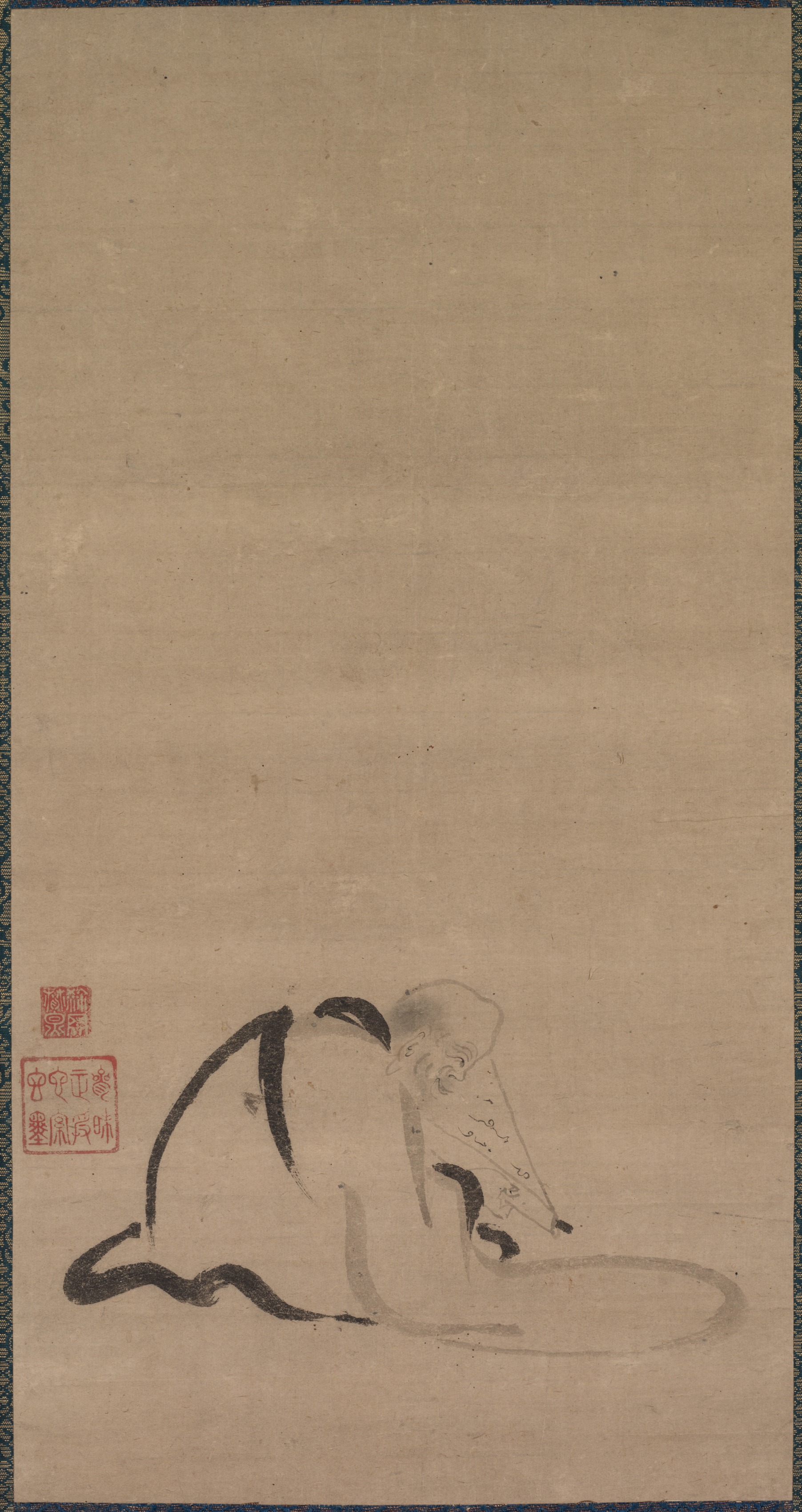 座る僧