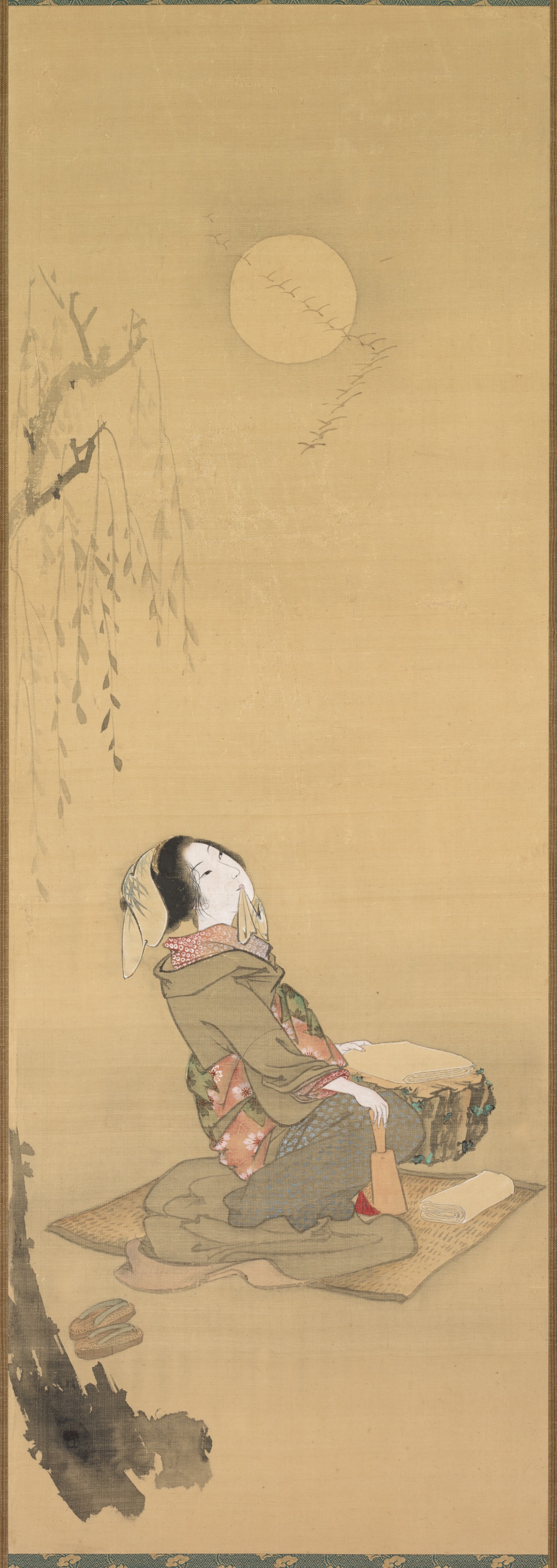 月を見る女性