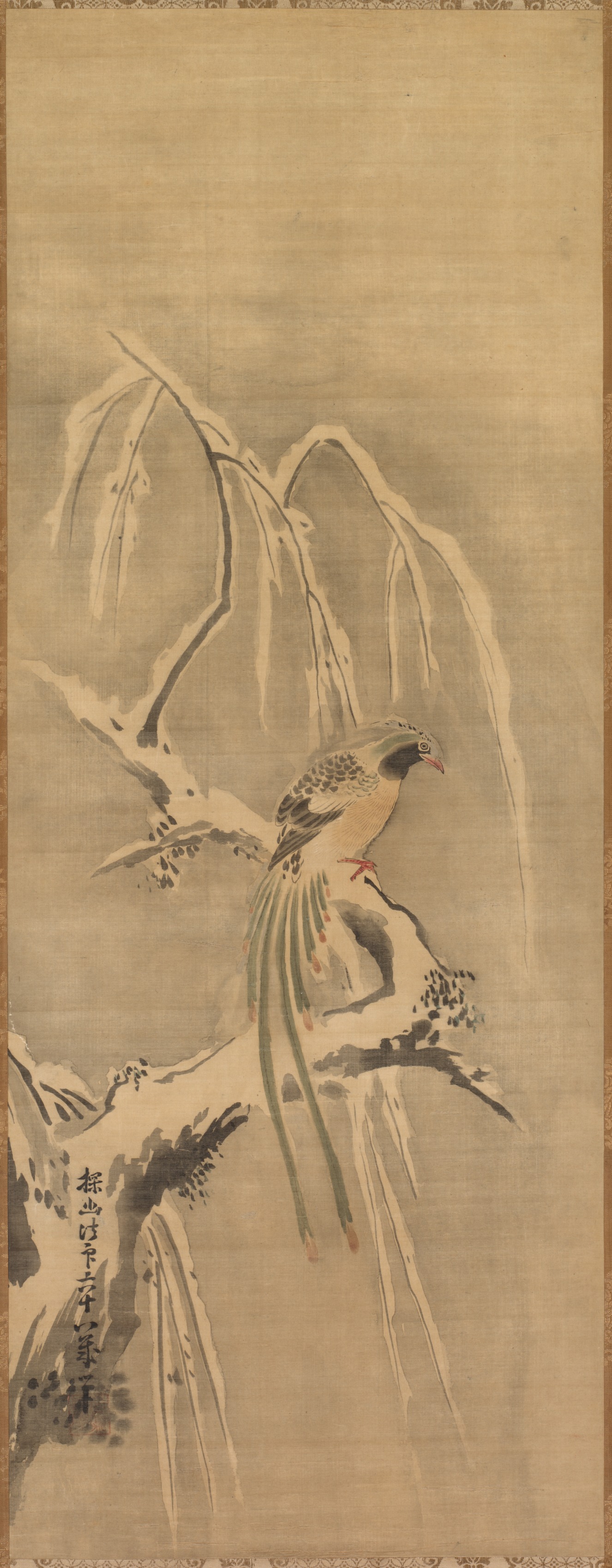 雪の枝に止まる中国の鳥