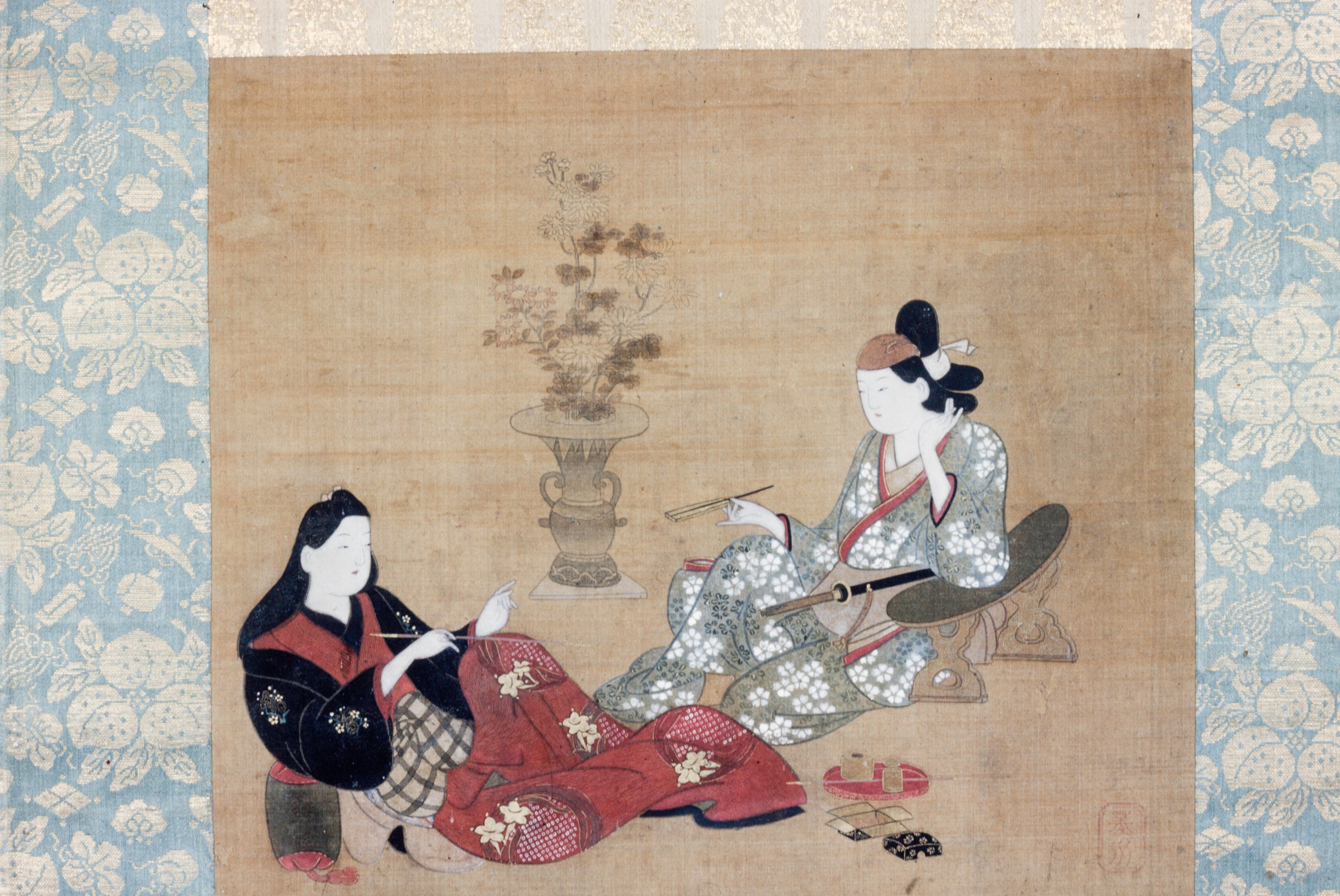 煙管を吸う遊女と役者