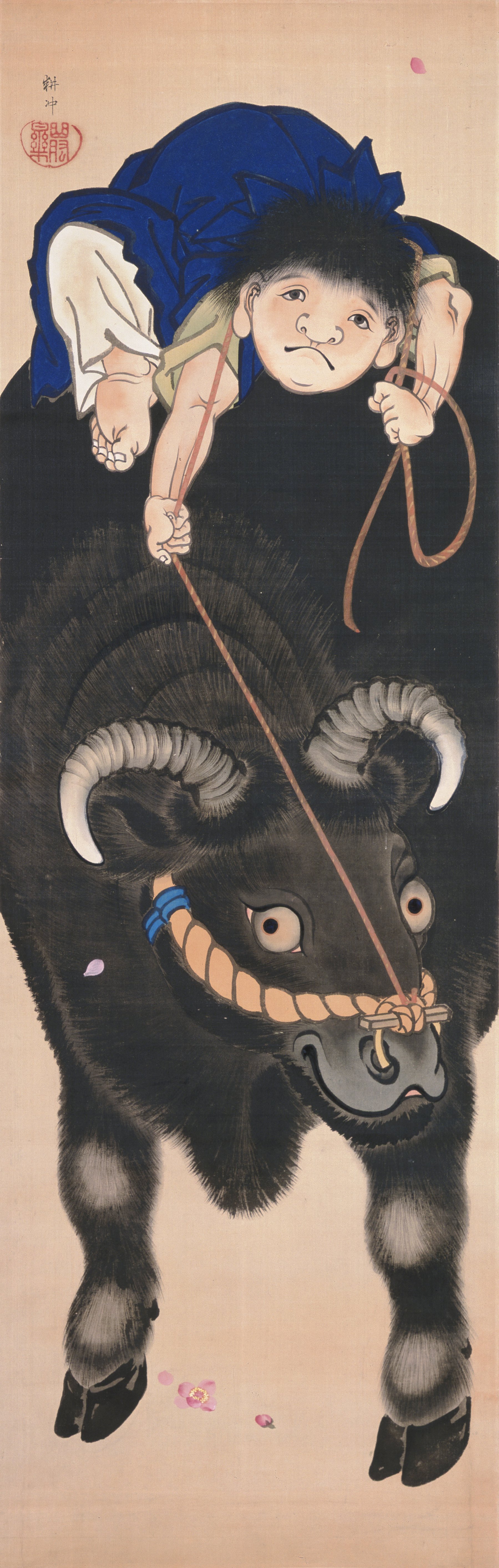 牛上の少年