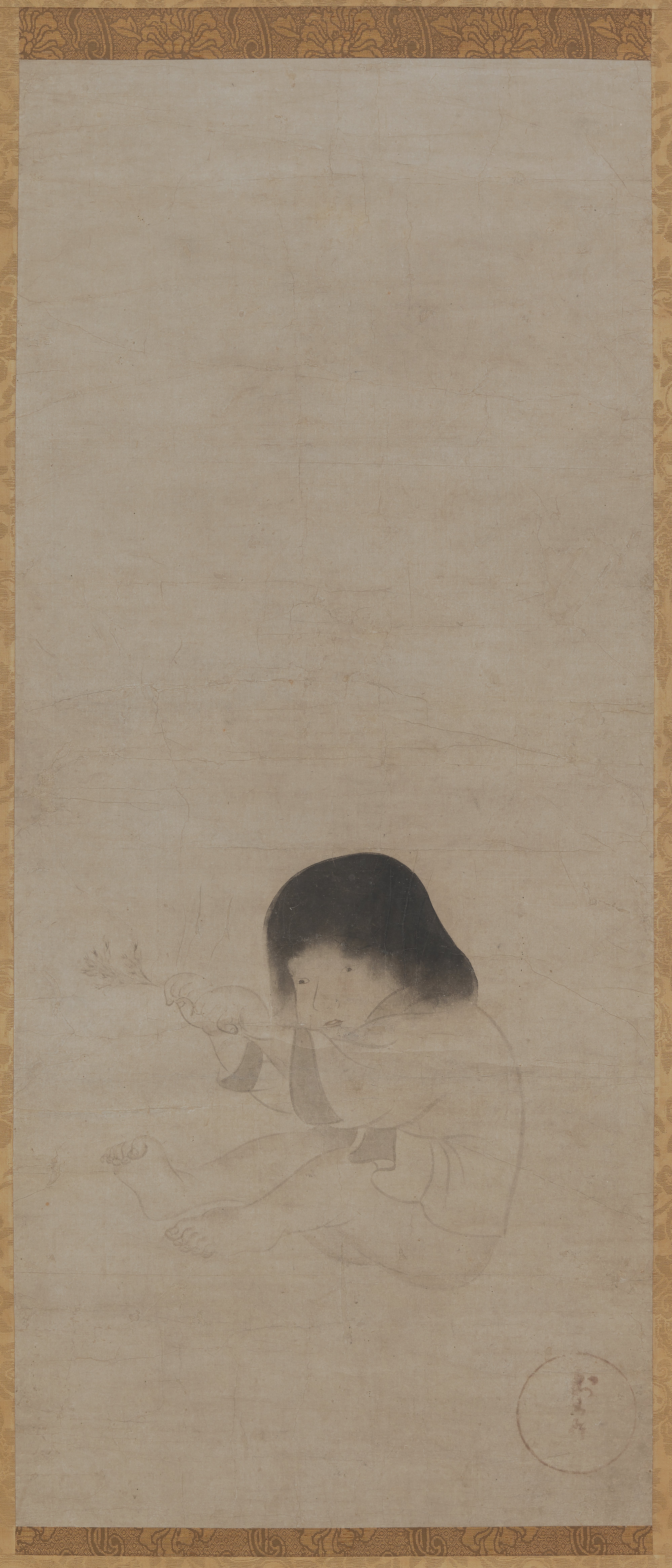 花の枝で遊ぶ子供